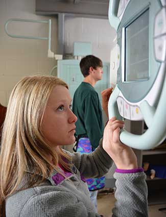 Student using xray equipment